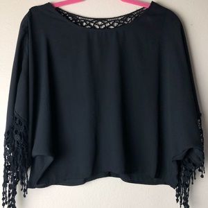Black blouse with fringe and lace like pattern